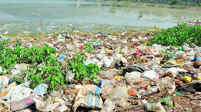 Huge amount of garbage piled up in Mudasarlova reservoir near Aarilova in Visakhapatnam on Thursday. Water from Mudasarlova reservoir is used as drinking water in major parts of the city.