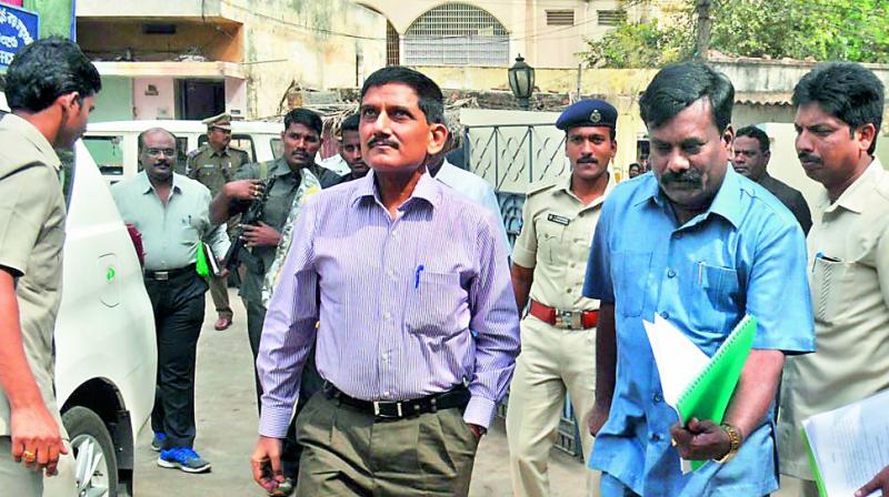 ACB DG R.P. Thakur inspects ACB office in Nellore on Thursday. DSP G.V. Ramudu is also seen. (Photo: DC)