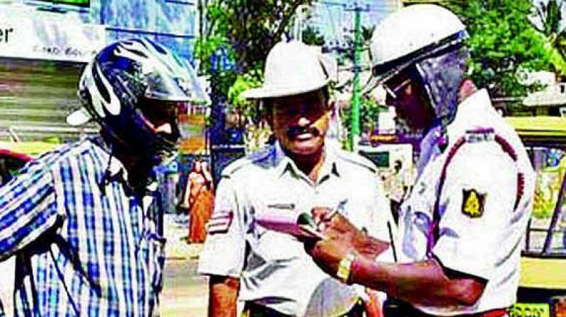 Riding without a helmet can be a costly affair. It will attract a fine of  Rs 1,000 with a cancellation of licence for three months.(Representational Image)