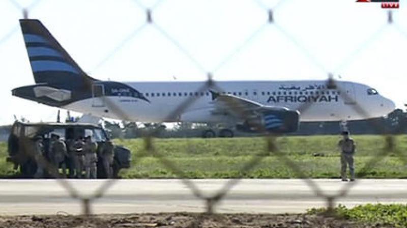 In this frame grab taken from television a hijacked Afriqiyah Airways A320 sits on the tarmac at Malta International airport. (Photo: AP)