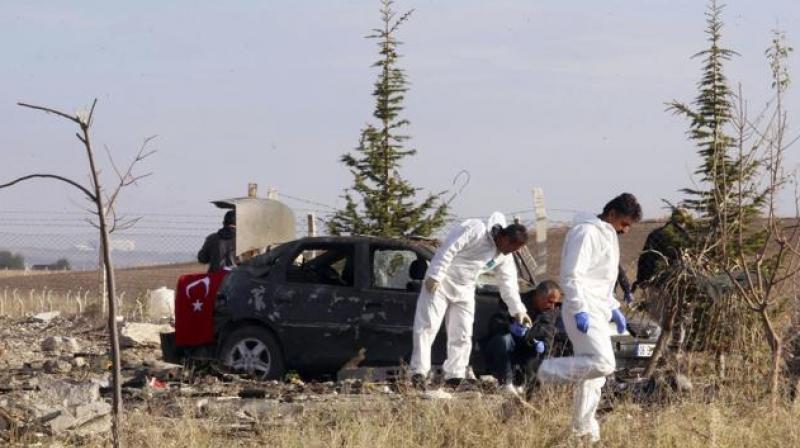 A file photo of police forensic officers work at the scene after suicide bombers blew themselves up in Haymana in the outskirts of Ankara, Turkey on October 8. (Photo: AP)