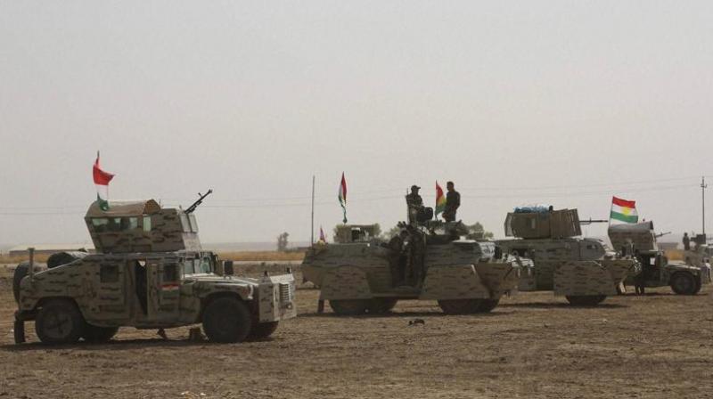 A peshmerga convoy drives towards a frontline in Khazer, about 30 kilometers (19 miles) east of Mosul. (Photo: AP)