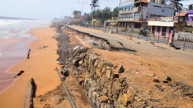 The walkway, seats and infrastructure at the Shangumugham beach damaged by high waves.