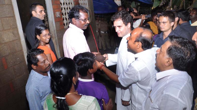 Congress president Rahul Gandhi at Sajeev Kunjayappans house which was submerged during the floods at Thelathuruthu in Manjaly in Paravur in Kochi on Tuesday. V.D. Satheesan, MLA, and opposition leader Ramesh Chennithala are also seen. (Photo: SUNOJ NINAN MATHEW)