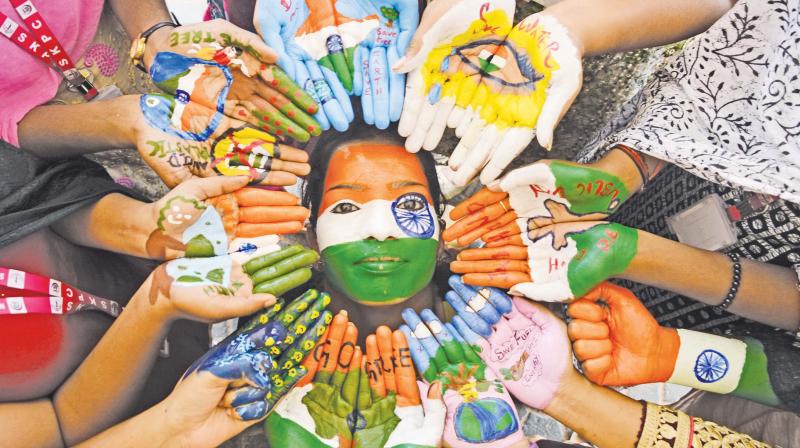 Students of Kanyaka Parameshwari College for Women participate in a face painting competition ahead of Republic Day celebrations. (Image DC)