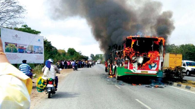 The bus that caught fire near Mudigere early on Saturday morning. The bus was carrying some fifty school children who were on a field trip. (Photo: DC)