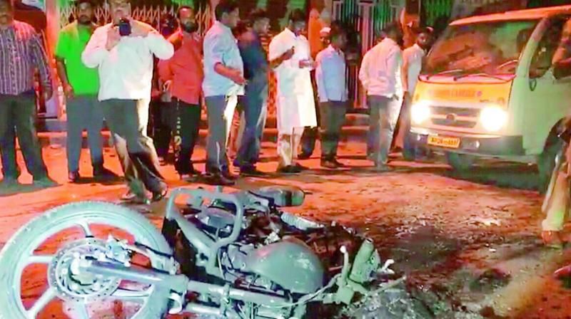 The police bike that was burnt during the violence at Sriramnagar on Tuesday by the relatives of murdered rowdy-sheeter Aamir Ali Khan.