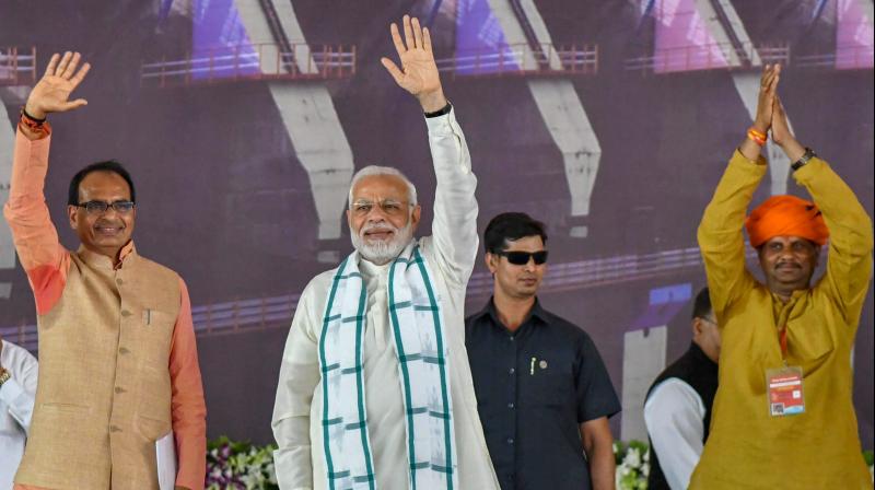 Prime Minister Narendra Modi with Madhya Pradesh Chief Minister Shivraj Singh Chouhan during the inauguration of Mohanpura Irrigation Project in Rajgarh on Saturday. (Photo: PTI)