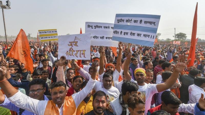 Supporters participate in Dharam Sabha, being organised by the Vishwa Hindu Parishad to push for the construction of Ram temple on Sunday. (Photo: PTI)