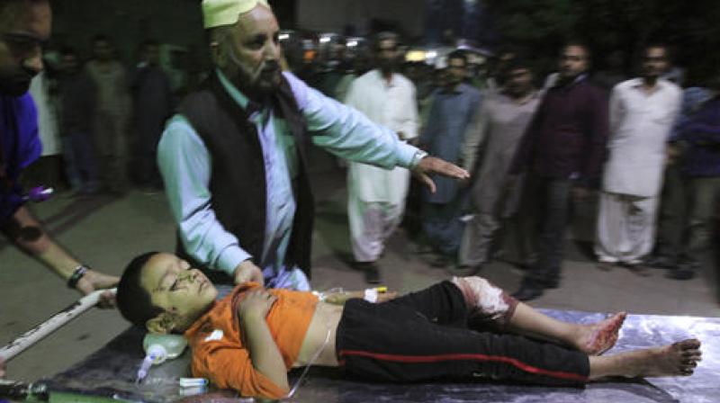 The bomb blast at the shrine of Sufi saint Shah Bilal Noorani, has killed dozens people and wounded more than 100 in the countrys southwest province. (Photo: AP)