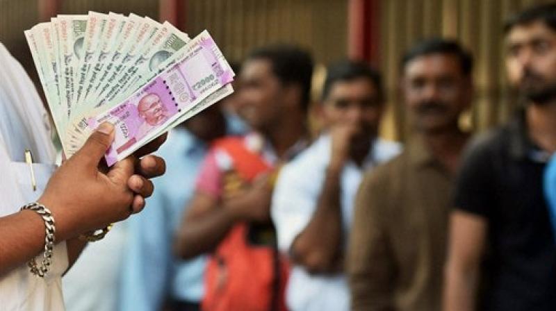 The RBIs announcement comes as anger intensified on Sunday with banks struggling to dispense money following the governments decision to withdraw large denomination notes in an attempt to curb black money. (Photo: PTI)