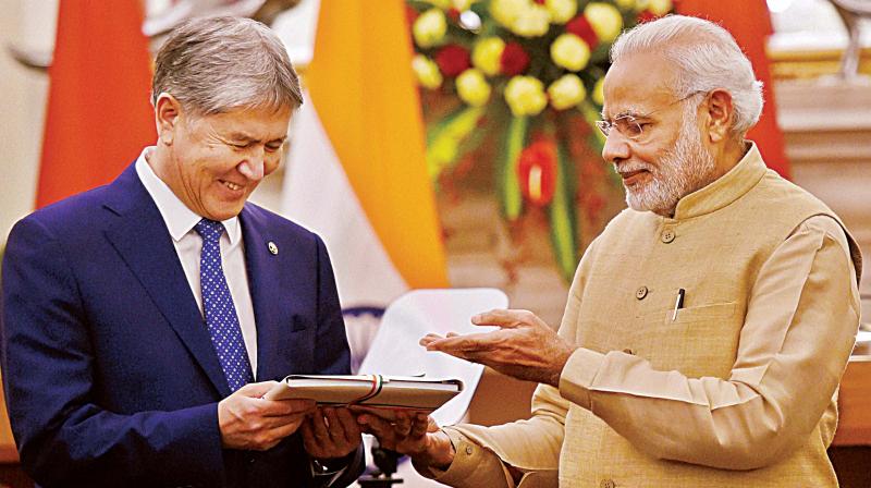 Prime Minister Narendra Modi with Kyrgyzstan President Almazbek Sharshenovich Atambayev at Hyderabad House in New Delhi on Tuesday 	(Photo: PTI)