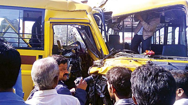 The mangled remains of school buses that collided near Shivamogga on Tuesday