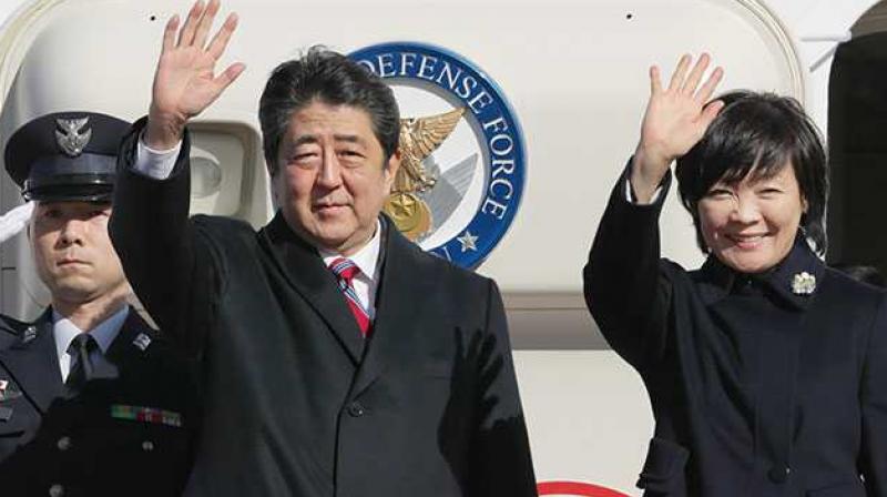 Shinzo Abe, wife Akie while boarding the PMs official plane, one of which has lost a wing panel. (Photo: AFP)