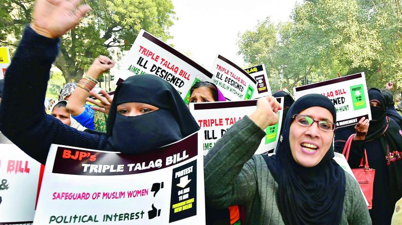 Women India Movement activists during a protest against the Triple Talaq Bill at Parliament Street, in New Delhi on Thursday. (Photo: PTI)