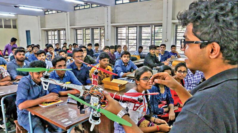 A student explains unmanned aerial vehicle to participants of  Shaastra, a techno festival of IIT-M, on Thursday. (Photo: DC)