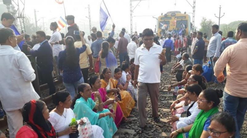 Protesters seen occupying the railway tracks at Nallasopara station, Mumbai. (Photo: ANI/File)