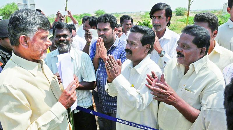 Chief Minister N. Chandrababu Naidu receive petitions from people at the Scavengers colony in Tirupati on Friday during his surprise visit. (Photo: DC)