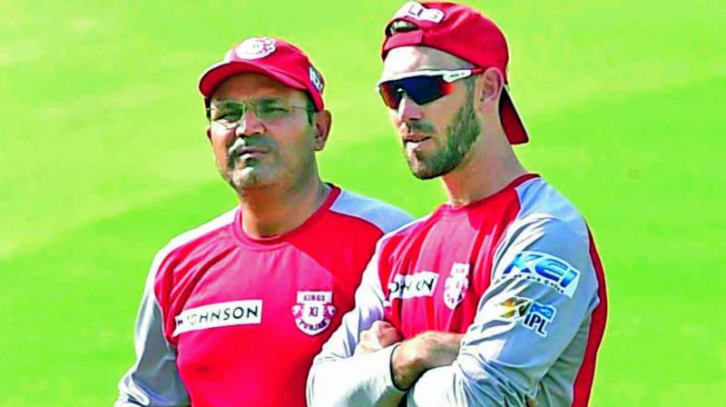 Kings XI Punjab coach Virender Sehwag (left) and captain Glenn Maxwell during a training session at the Eden Gardens on Wednesday. (Photo: PTI)