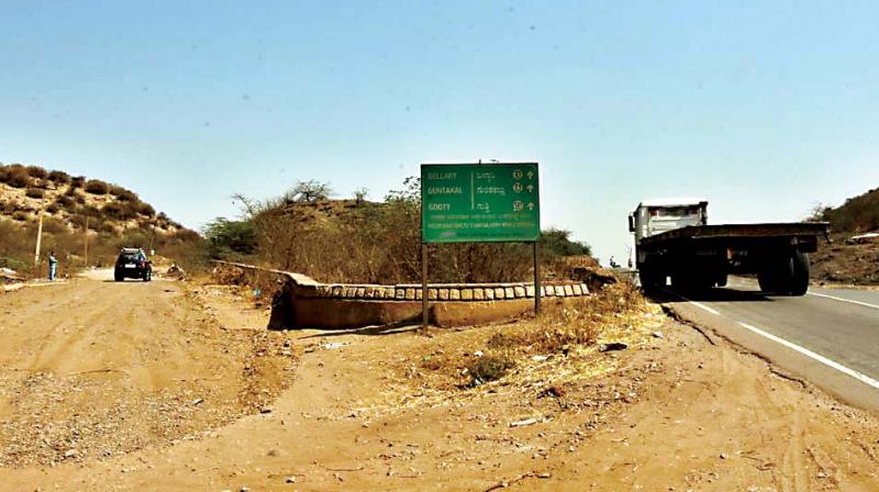 The Neolithic ashmound at Budikanama Pass on Ballari-Hospete Road near the Ballari Thermal Power Station and inset is the damaged ashmound 	 DC