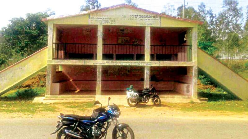 The two-storeyed bus shelter with  a staircase running on either side of it for the safety of villagers at Nagatanapura on the periphery of the Bandipur National Park