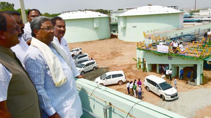 Chief Minister Siddaramaiah at the Koramangala and Challeghatta Water Treatment Plant in Bengaluru after inaugurating it on Monday. Minister K.J. George and MLA Arvind Limbavali are also seen (Photo: DC)