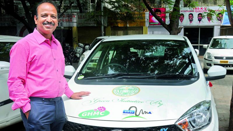 Srinivasa Chary Enugurthi with one of the electric vehicles.