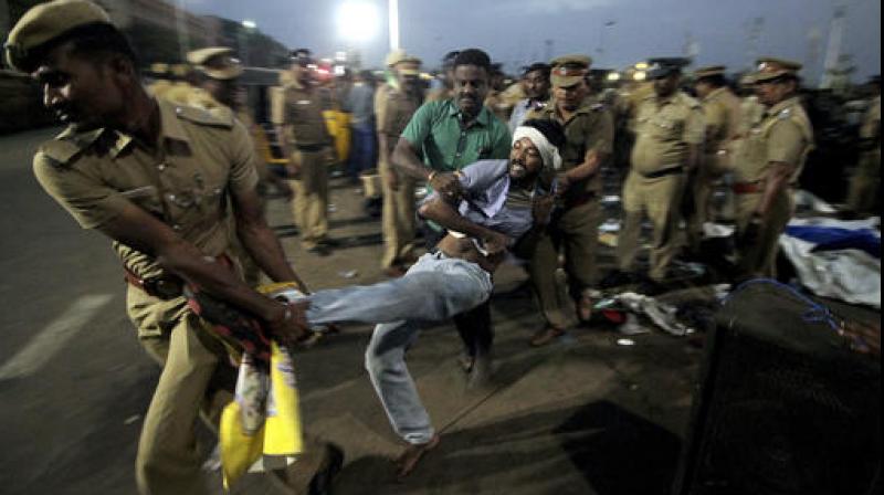 Pro-Jallikattu protesters during a clash with the police near Marina Beach in Chennai on Monday. (Photo: AP)