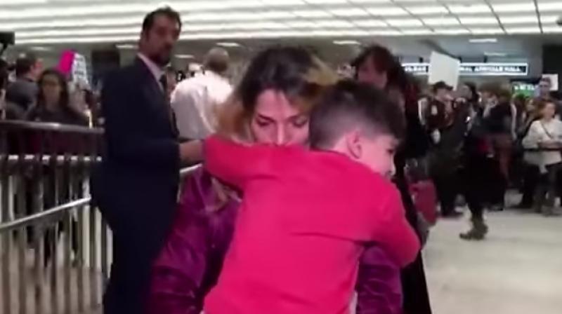 The boy reunited with his mom after he was detained for hours at the airport. (Photo: YouTube)