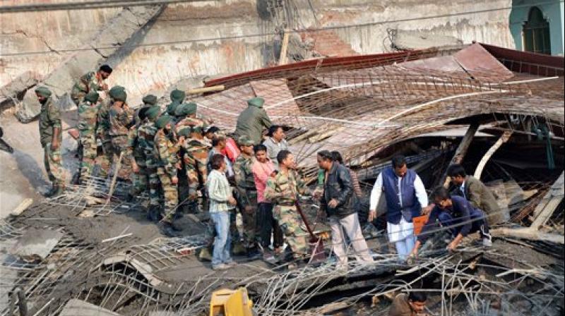 Army jawans carry out rescue and relief works after collapse of an under-construction building in Chakeri, Kanpur on Wednesday. (Photo: PTI)