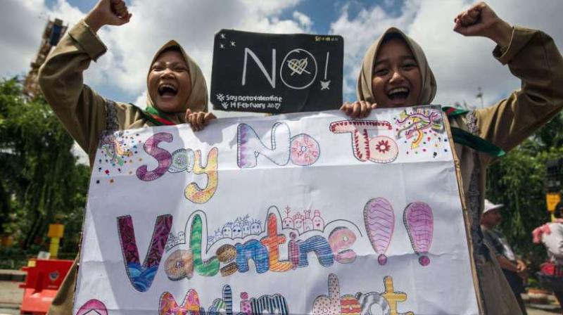 Girls from a local boarding school shout during an anti-Valentines Day rally in Surabaya, East Java province on Feb 13, 2017. (Photo: AFP)