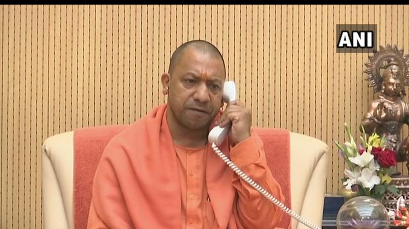 After being denied permission to land a chopper in West Bengal, Uttar Pradesh Chief Minister Yogi Adityanath on Sunday addressed a rally in Raiganj in Dinajpur district over the phone. (Photo: ANI)