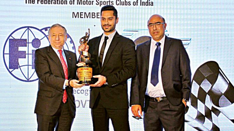 President of FIA John Todt (left) and FMSCI President Akbar Ebrahim present Gaurav Gill with the Motorsports Person 2016 award at the FMSCI awards function (Photo: DC)