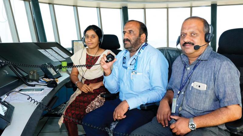 Airports Authority of India (AAI)  air traffic control  deputy general manager  G.Pradeep Kumar (right),  assistant GM  Sreelesh Sreedharan, and junior  Executive P V Hridya