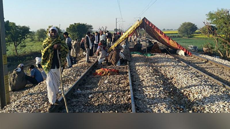 As part of the reservation movement, the protesters occupied the tracks near Malarna Dungaar station in Maksudanpura village of Sawai Madhopur district. (Photo: ANI)