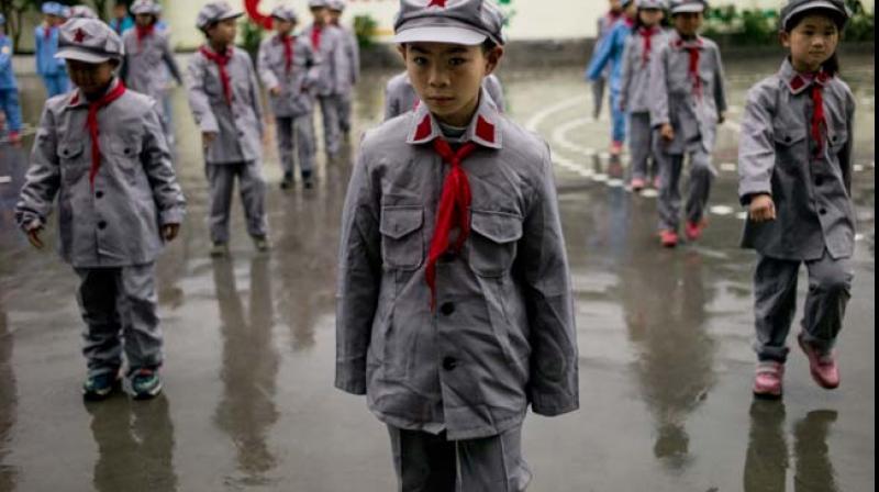 Students at the Yang Dezhi Red Army elementary school in Wenshui, in Chinas Guizhou province. (Photo: AFP)