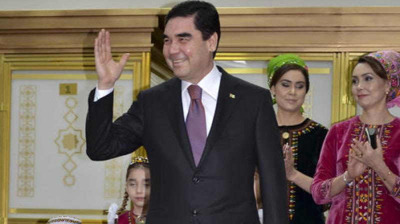 Turkmenistan President Gurbanguly Berdimuhamedov greets journalists after casting his ballot at a polling station in Ashgabat, Turkmenistan. (Photo: AP)