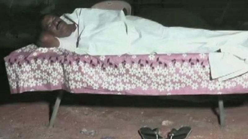 Nimmala Rama Naidu, MLA from Andhras Palakole was seen sleeping on a bed with a pink sheet, covering himself with a white blanket. (Photo: ANI)