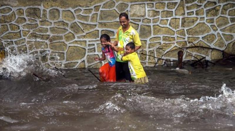 While playing, the children got stuck in a pothole. Seeing them, Patil jumped out of his seat and rushed to save them. (Representational Image | PTI)