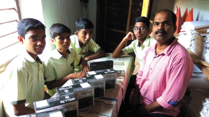 The students who received the audio system for learning with their resource teacher Anil A.K. (Photo:  DC)