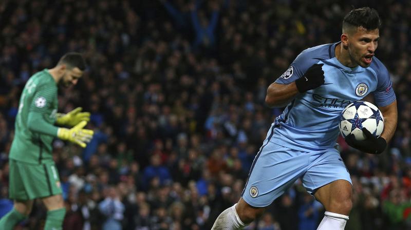 Sergio Aguero celebrates after scoring his sides second goal. (Photo: AP)