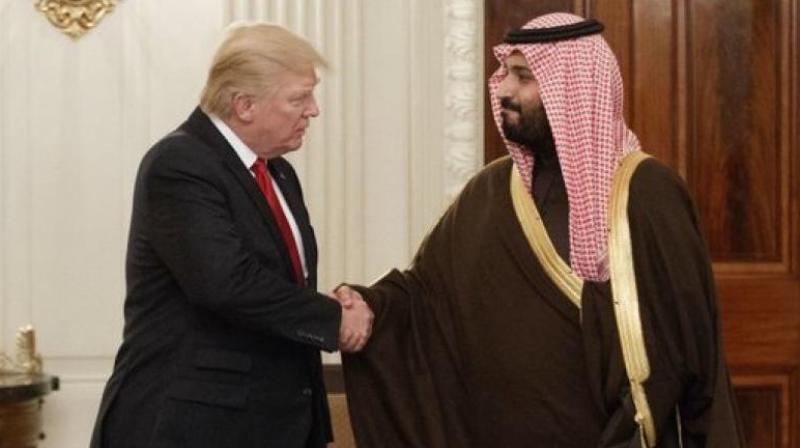 President Donald Trump shakes hands with Saudi Prince Mohammed bin Salman in the State Dining Room of the White House in Washington. (Photo: AP)