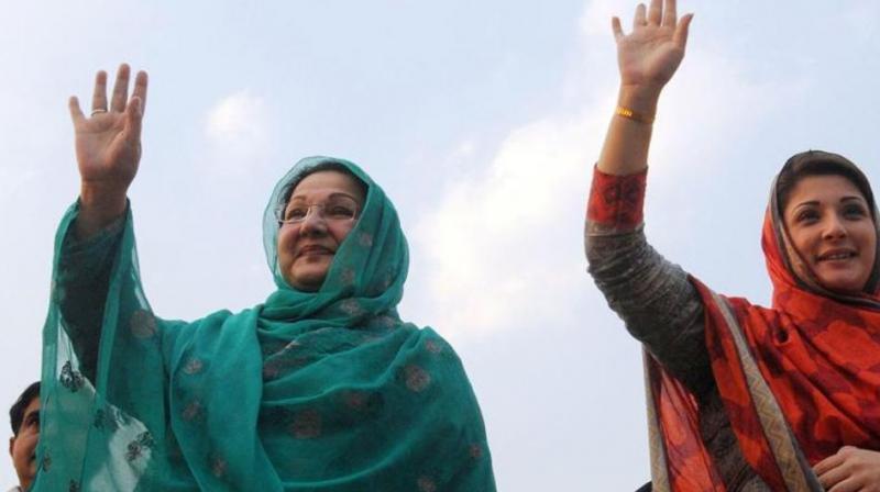 File photograph shows Pakistans Prime Minister Nawaz Sharifs daughter Maryam Nawaz and her mother Kulsoom Nawaz waving to supporters during an election campaign rally in Lahore in 2014. (Photo: AFP)
