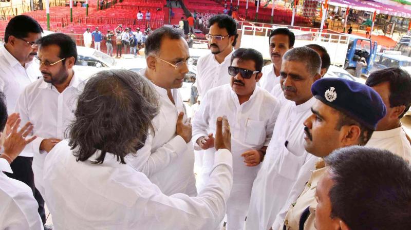 KPCC president Dinesh Gundurao inspects the preparations for Congress president Rahul Gandhis rally in Haveri, on Friday