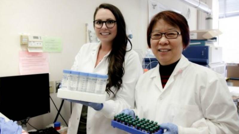 PhD student Lindsay Blackstock (left) and her supervisor, Xing-Fang Li, found telltale signs of urine in public swimming pools by looking for traces of artificial sweetener. (Image: University of Alberta)