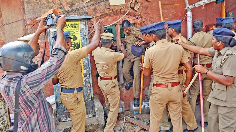 Women cops being rescued from the burning  police station.