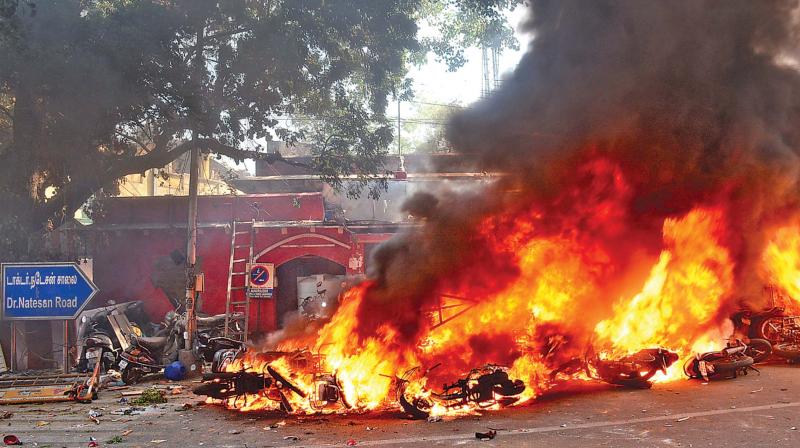 A mob sets Ice House police station ablaze on Monday. (Photo: N.Sampath)