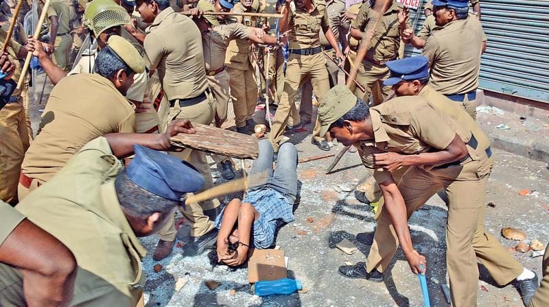 Police personnel lathicharge a protester at Triplicane on Monday (Photo: DC)