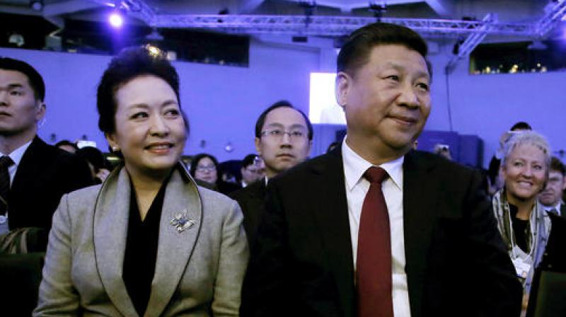 Chinas President Xi Jinping and his wife Peng Liyuan during the opening session of the World Economic Forum in Davos, Switzerland. (Photo: AP)