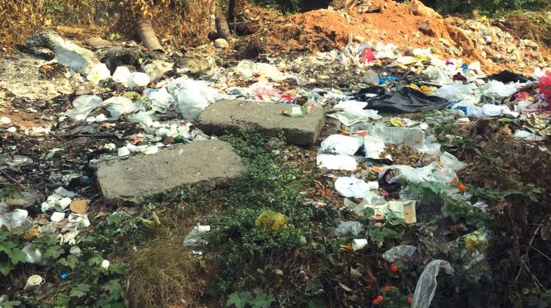 Waste materials dumped in a town area.